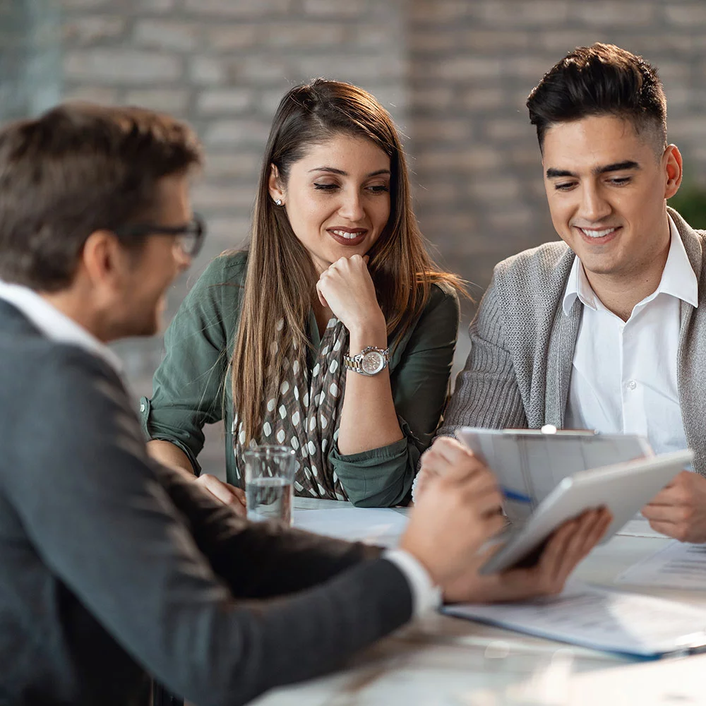 couple discussing paperwork with professional